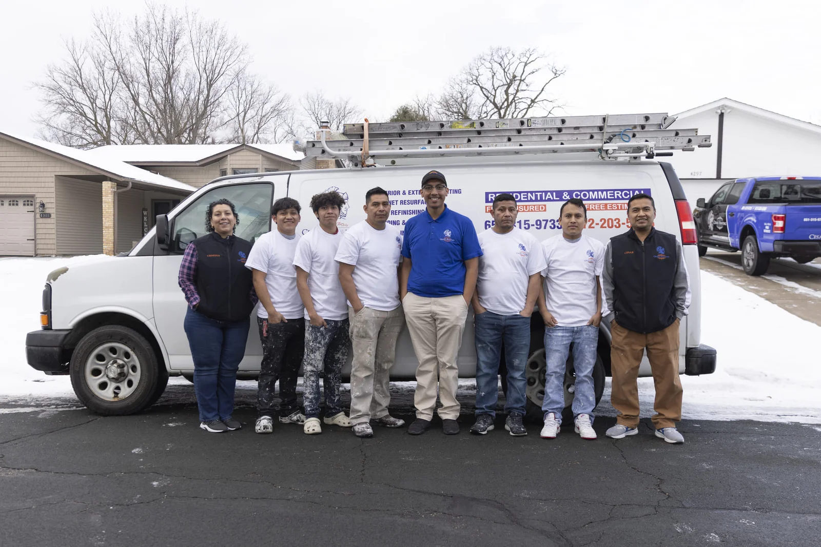 Painting crew team with service van and ladder rack equipment