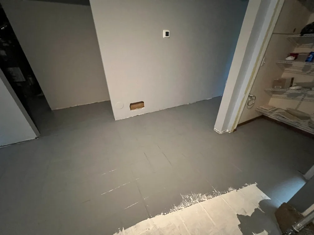 Drywall patches and interior wall preparation with protective floor covering