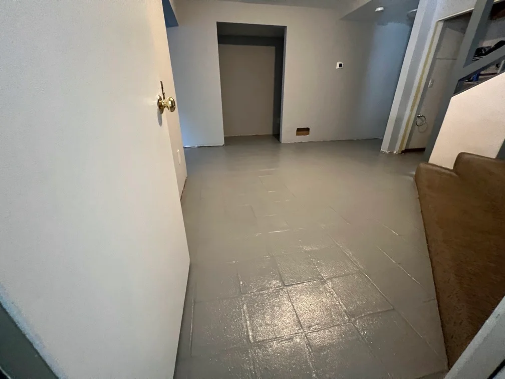 Freshly painted interior walls and drywall finishing in residential room with multiple doorways