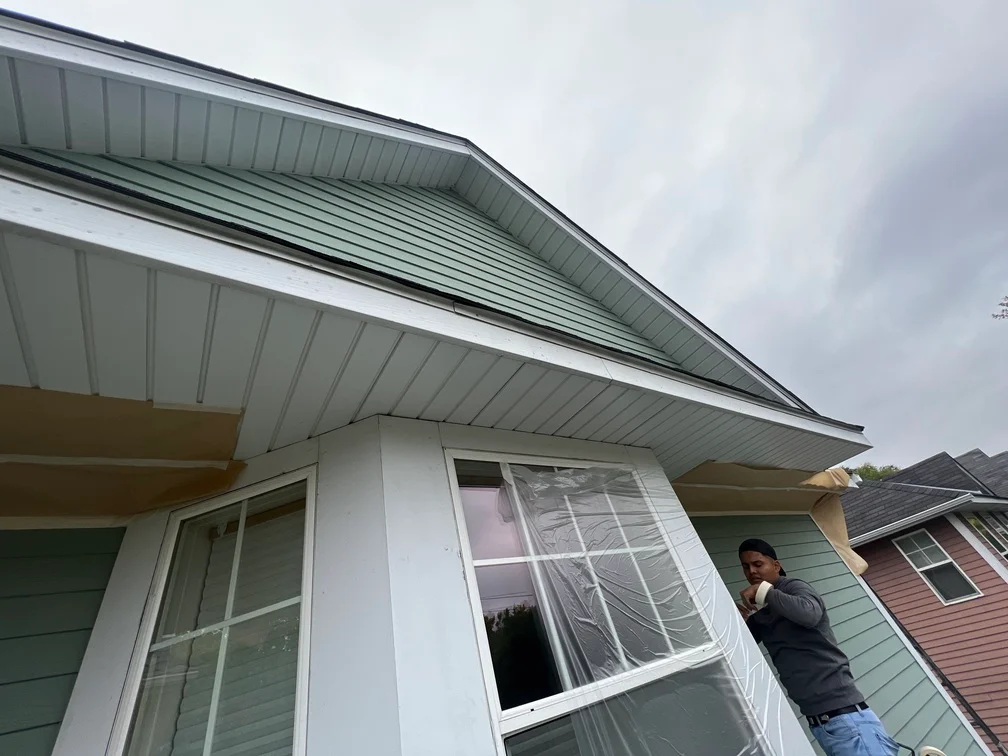 White painted metal soffit and fascia trim on residential home exterior